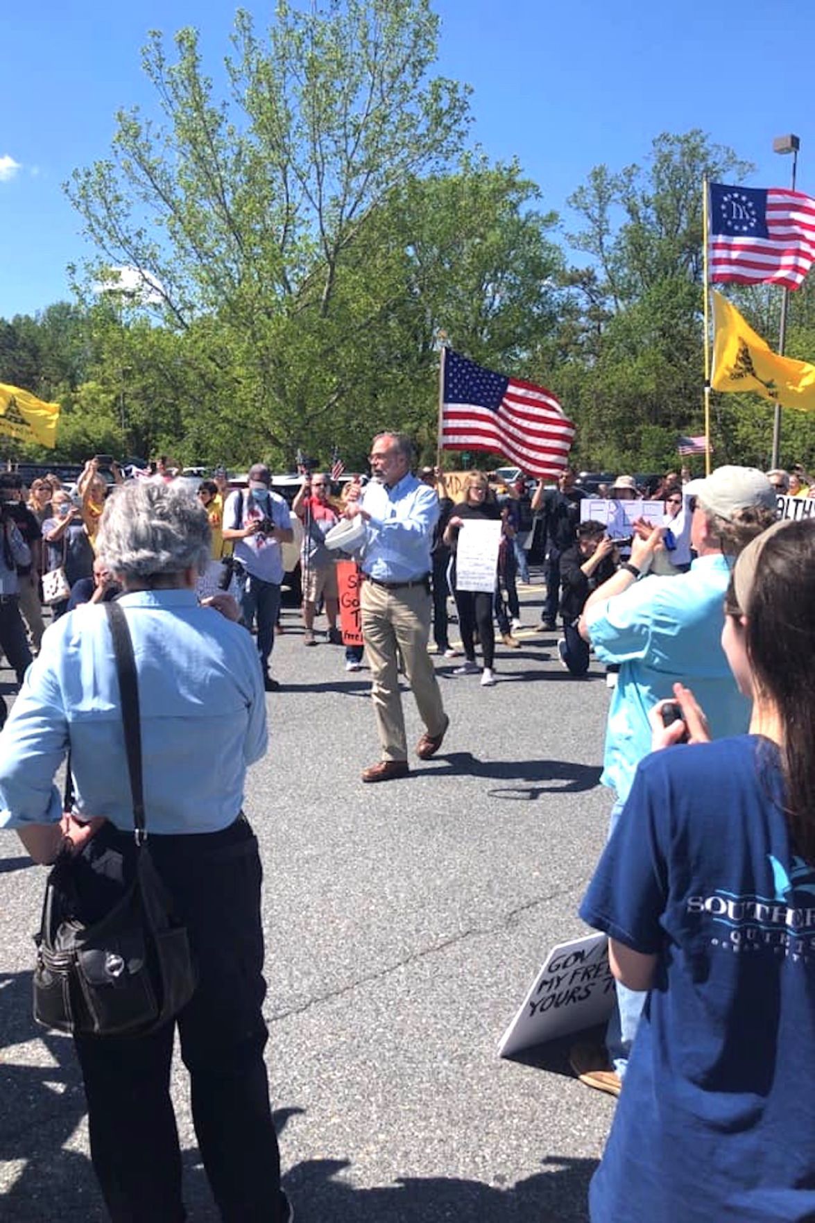 Reopen rally shows rift between Harris, Hogan
